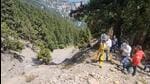 Landslide experts conducting an inspection of cracks in Nainital. (HT Photo)