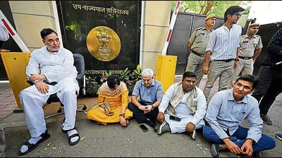 Delhi ministers wait outside the LG Secretariat on Friday. (Sanjeev Verma/ HT Photo) Delhi ministers wait outside the LG Secretariat on Friday. (Sanjeev Verma/ HT Photo)