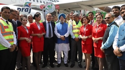 Union minister Hardeep Singh Puri with the crew of the historic AIX Connect flight. Union minister Hardeep Singh Puri with the crew of the historic AIX Connect flight.