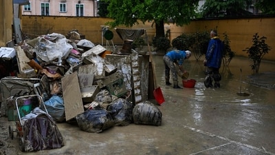 Waste and damaged belongings collected by residents cleaning their flooded homes is gathered in a muddy courtyard on May 19, 2023 in Faenza, after floodwaters hit the Emilia-Romagna region. (AFP) Waste and damaged belongings collected by residents cleaning their flooded homes is gathered in a muddy courtyard on May 19, 2023 in Faenza, after floodwaters hit the Emilia-Romagna region. (AFP)