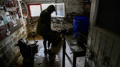 A resident cleans his flooded basement on May 19, 2023 in Faenza, after floodwaters hit the Emilia-Romagna region. (AFP) A resident cleans his flooded basement on May 19, 2023 in Faenza, after floodwaters hit the Emilia-Romagna region. (AFP)