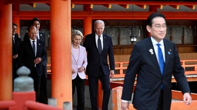 Japan's Prime Minister Fumio Kishida (R) walks in front of US President Joe Biden and European Commission President Ursula von der Leyen and other leaders visiting the Itsukushima Shrine on Miyajima Island in Hatsukaichi on May 19, 2023, during the G7 Leaders' Summit being held in Hiroshima. (AFP)