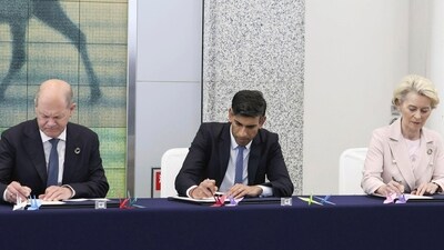 From left, Germany's Chancellor Olaf Scholz, Britain's Prime Minister Rishi Sunak and European Commission President Ursula von der Leyen sign a book during their visit at Hiroshima Peace Memorial Museum in Peace Memorial Park as part of the G7 Hiroshima Summit in Hiroshima, western Japan, Friday, May 19, 2023. (AP)