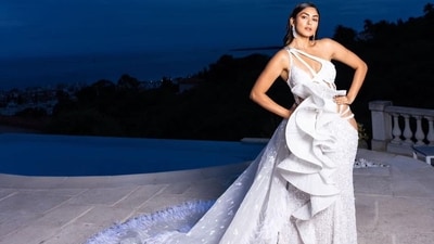 Mrunal Thakur made her red carpet debut at 2023 Cannes Film Festival in a white Falguni Shane Peacock gown with cut-out detailing. Mrunal Thakur made her red carpet debut at 2023 Cannes Film Festival in a white Falguni Shane Peacock gown with cut-out detailing. 