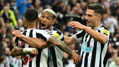 TOPSHOT - Newcastle United's Brazilian midfielder Bruno Guimaraes (L) celebrates after scoring his team fourth goal during the English Premier League football match between Newcastle United and Brighton (AFP)