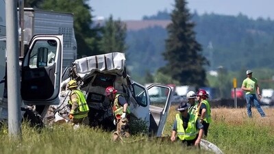 Oregon State Police troopers and firefighters assist in recovering a crash site on Thursday, May 18, 2023, along Interstate 5 in Albany, Ore. (Alex Powers/Albany Democrat-Herald via AP) Oregon State Police troopers and firefighters assist in recovering a crash site on Thursday, May 18, 2023, along Interstate 5 in Albany, Ore. (Alex Powers/Albany Democrat-Herald via AP)