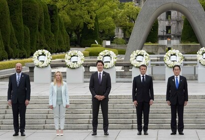 (L-R) European Council President Charles Michel, Italian Prime Minister Giorgia Meloni, Canadian Prime Minister Justin Trudeau, French President Emmanuel Macron and Japan's Prime Minister Fumio Kishida pose for a group photo after laying flower wreaths at the Cenotaph for Atomic Bomb Victims in the Peace Memorial Park as part of the G7 Leaders' Summit in Hiroshima on May 19, 2023. (AFP) (L-R) European Council President Charles Michel, Italian Prime Minister Giorgia Meloni, Canadian Prime Minister Justin Trudeau, French President Emmanuel Macron and Japan's Prime Minister Fumio Kishida pose for a group photo after laying flower wreaths at the Cenotaph for Atomic Bomb Victims in the Peace Memorial Park as part of the G7 Leaders' Summit in Hiroshima on May 19, 2023. (AFP)