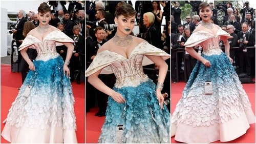 Urvashi Rautela walks the Cannes red carpet in a off-shoulder gown and blue lips.