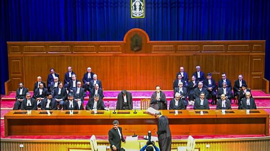 CJI Justice DY Chandrachud administers the oath of office to senior advocate KV Viswanathan as Supreme Court judge during the swearing-in ceremony, in New Delhi on Friday. (ANI)