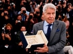 The 76th Cannes Film Festival - Photocall for the film "Indiana Jones and the Dial of Destiny" (Indiana Jones et le cadran de la destinee) Out of Competition - Cannes, France, May 19, 2023. Cast member Harrison Ford holds his Honorary Palme d'Or Award. REUTERS/Yara Nardi