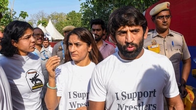 Wrestlers Vinesh Phogat, Bajrang Punia and Sakshi Malik outside Arun Jaitley Stadium during the IPL 2023 cricket match between Delhi Capitals and Chennai Super Kings. (PTI) Wrestlers Vinesh Phogat, Bajrang Punia and Sakshi Malik outside Arun Jaitley Stadium during the IPL 2023 cricket match between Delhi Capitals and Chennai Super Kings. (PTI)