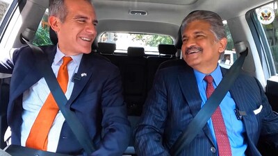 Ambassador of the United States Eric Garcetti and businessman Anand Mahindra share a ride together in Mumbai.