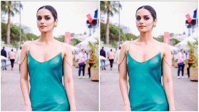 In golden ear studs and a golden embellished handbag from the shelves of Viange, Manushi further accessorised her look for the day. (Instagram/@manushi_chhillar) In golden ear studs and a golden embellished handbag from the shelves of Viange, Manushi further accessorised her look for the day. (Instagram/@manushi_chhillar)