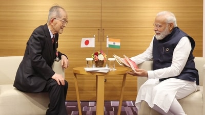 PM Narendra Modi meets Japanese author Tomio Mizokami in Hiroshima Saturday. PM Narendra Modi meets Japanese author Tomio Mizokami in Hiroshima Saturday.