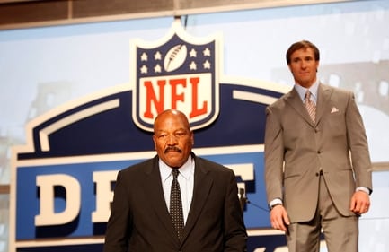 Former NFL star Jim Brown appears on stage with New Orleans Saints quarterback Drew Breese (R) before the start of the 2010 NFL draft at Radio City Music Hall in New York April 22, 2010. (REUTERS)