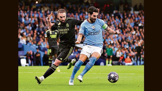 Manchester City's Ilkay Gundogan with Real Madrid's Dani Carvajal in the Champions League semi-final on Wednesday. City won 4-0. (REUTERS)