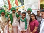 Wrestler Vinesh Phogat poses for a picture with the farmers during the ongoing protest at Jantar Mantar. Wrestler Vinesh Phogat poses for a picture with the farmers during the ongoing protest at Jantar Mantar.