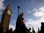 UK Heatwave: People walk in front of the Elizabeth Tower, more commonly known as Big Ben in London, Britain.