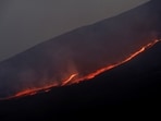 Lava flows downhill as Mount Etna erupts, as seen from Pizzi Deneri on the north side of volcano, on the island of Sicily, in Catania, (File Photo)