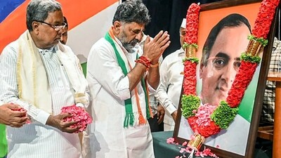 Karnataka Chief Minister Siddaramaiah and Deputy CM DK Shivakumar pay tribute to former prime minister Rajiv Gandhi on his 32nd death anniversary, in Bengaluru on Sunday. (DK Shivkumar Twitter) Karnataka Chief Minister Siddaramaiah and Deputy CM DK Shivakumar pay tribute to former prime minister Rajiv Gandhi on his 32nd death anniversary, in Bengaluru on Sunday. (DK Shivkumar Twitter)