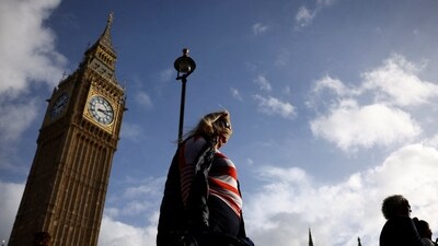 UK Heatwave: People walk in front of the Elizabeth Tower, more commonly known as Big Ben in London, Britain. (Reuters)