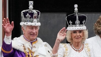 Britain's King Charles III and Queen Camilla wave to the crowds from the balcony of Buckingham Palace. (AP) Britain's King Charles III and Queen Camilla wave to the crowds from the balcony of Buckingham Palace. (AP)