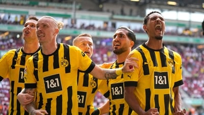 Borussia Dortmund players celebrate after Dortmund's Sebastien Haller, right, scored his side's second goal during the German Bundesliga soccer match between FC Augsburg and Borussia Dortmund at the WWK Arena in Augsburg, Germany, Sunday, May 21, 2023. (AP Photo/Matthias Schrader) (AP) Borussia Dortmund players celebrate after Dortmund's Sebastien Haller, right, scored his side's second goal during the German Bundesliga soccer match between FC Augsburg and Borussia Dortmund at the WWK Arena in Augsburg, Germany, Sunday, May 21, 2023. (AP Photo/Matthias Schrader) (AP)