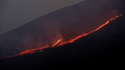Lava flows downhill as Mount Etna erupts, as seen from Pizzi Deneri on the north side of volcano, on the island of Sicily, in Catania, (File Photo) (REUTERS)