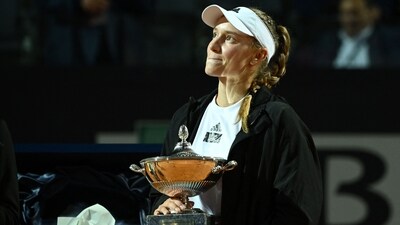 Kazakhstan's Elena Rybakina poses with her trophy celebrating winning the final match of the Women's WTA Rome Open tennis tournament (AFP)