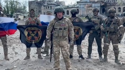 This video grab shows Yevgeny Prigozhin holding a Russian national flag in front of his soldiers holding Wagner Group's flags in Bakhmut. (AFP) This video grab shows Yevgeny Prigozhin holding a Russian national flag in front of his soldiers holding Wagner Group's flags in Bakhmut. (AFP)