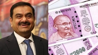 Adani group chairman Gautam Adani and ₹2000 denomination. Adani group chairman Gautam Adani and ₹2000 denomination.