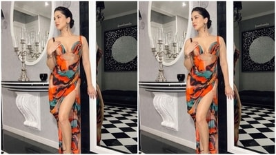 Sunny looked ravishing in the multicoloured dress featuring a plunging neckline, corset patterns, sleeveless details and a thigh high slit in one side. (Instagram/@sunnyleone) Sunny looked ravishing in the multicoloured dress featuring a plunging neckline, corset patterns, sleeveless details and a thigh high slit in one side. (Instagram/@sunnyleone)
