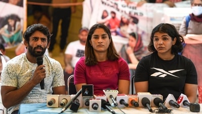 Wrestlers Bajrang Punia, Vinesh Phogat and Sakshi Malik address a press conference during their ongoing protest against the Wrestling Federation of India (WFI) chief Brij Bhushan Sharan Singh over the alleged harassment of women wrestlers, at Jantar Mantar, in New Delhi on Saturday.