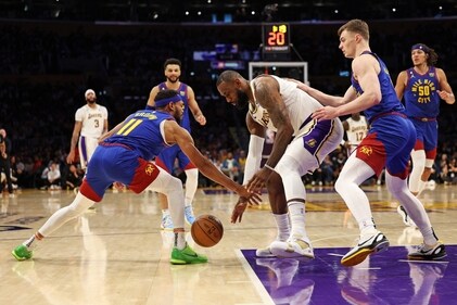 LeBron James #6 of the Los Angeles Lakers handles the ball against Bruce Brown #11 of the Denver Nuggets and Christian Braun #0 of the Denver Nuggets during the first quarter in game three of the Western Conference Finals at Crypto.com Arena on May 20, 2023 in Los Angeles, California. (Getty Images via AFP) LeBron James #6 of the Los Angeles Lakers handles the ball against Bruce Brown #11 of the Denver Nuggets and Christian Braun #0 of the Denver Nuggets during the first quarter in game three of the Western Conference Finals at Crypto.com Arena on May 20, 2023 in Los Angeles, California. (Getty Images via AFP)