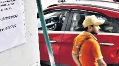 A notice at a Hyderabad petrol pump says ₹2,000 notes will be accepted only for transactions above ₹1,000, after the RBI announced withdrawal of the high-value banknote. (PTI) A notice at a Hyderabad petrol pump says ₹2,000 notes will be accepted only for transactions above ₹1,000, after the RBI announced withdrawal of the high-value banknote. (PTI)