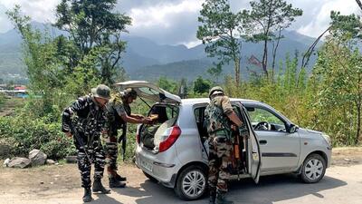 Army personnel and Assam Rifles check a vehicle on NH-37 in violence-hit Manipur. (Indian Army) Army personnel and Assam Rifles check a vehicle on NH-37 in violence-hit Manipur. (Indian Army)