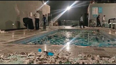Fake dollar notes strewn around at the swimming pool of the Zirakpur hotel. (HT Photo)