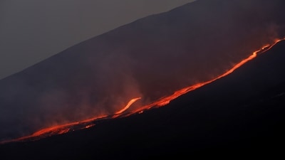 Mount Etna Eruption: Lava flows downhill as Mount Etna erupts. (Reuters)