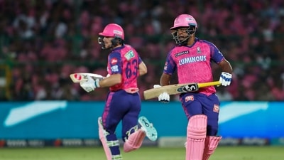 Rajasthan Royals' captain Sanju Samson, right, and Jos Buttler run between the wickets during the Indian Premier League cricket match (AP)