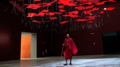 A man wearing traditional Masai clothes walks under an installation at the Biennale International Architecture exhibition in Venice, Italy. (AP Photo/Antonio Calanni) A man wearing traditional Masai clothes walks under an installation at the Biennale International Architecture exhibition in Venice, Italy. (AP Photo/Antonio Calanni)