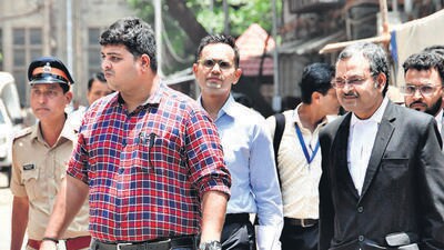 Mumbai, India - May 22, 2023: Former Zonal Director of Mumbai Narcotics Control Bureau Sameer Wankhede being escorted outside the Bombay High Court after the court extended his interim protection against coercive action in the bribery case in connection with the Cordelia Cruise drug bust till June 8, in Mumbai, India, on Monday, May 22, 2023. (Photo by Bhushan Koyande/HT Photo) (HT PHOTO) Mumbai, India - May 22, 2023: Former Zonal Director of Mumbai Narcotics Control Bureau Sameer Wankhede being escorted outside the Bombay High Court after the court extended his interim protection against coercive action in the bribery case in connection with the Cordelia Cruise drug bust till June 8, in Mumbai, India, on Monday, May 22, 2023. (Photo by Bhushan Koyande/HT Photo) (HT PHOTO)