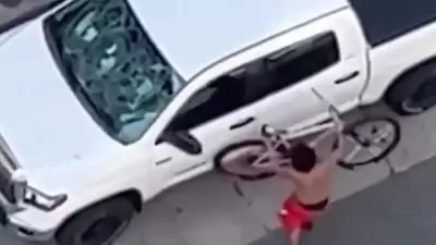 After the attack, one of the people could be seen using his bicycle to attack the man’s vehicle. After the attack, one of the people could be seen using his bicycle to attack the man’s vehicle.