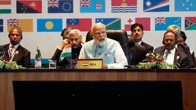 Modi addresses a meeting with Pacific Island leaders to discuss ways to better cooperate in Port Moresby, Papua New Guinea. As Prime Minister Narendra Modi arrived in Papua New Guinea (PNG) on Sunday, a rare moment was seen at the Port Moresby airport where PNG Prime Minister James Marape touched his feet and sought his blessings. (AP) Modi addresses a meeting with Pacific Island leaders to discuss ways to better cooperate in Port Moresby, Papua New Guinea. As Prime Minister Narendra Modi arrived in Papua New Guinea (PNG) on Sunday, a rare moment was seen at the Port Moresby airport where PNG Prime Minister James Marape touched his feet and sought his blessings. (AP)