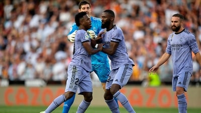 Real Madrid's Vinicius Junior is restrained by Antonio Rudiger and Thibaut Courtois after being sent off (REUTERS)