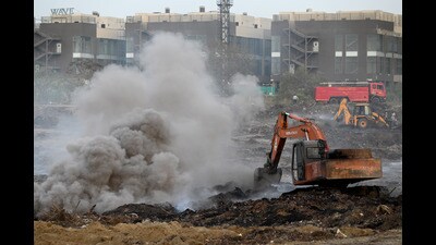 The fire at the vacant plot in Noida came under control after five days on Monday. (Sunil Ghosh/HT Photo) The fire at the vacant plot in Noida came under control after five days on Monday. (Sunil Ghosh/HT Photo)