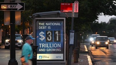 A poster at a bus shelter shows the national debt in Washington, DC, on May 21, 2023. (AFP) A poster at a bus shelter shows the national debt in Washington, DC, on May 21, 2023. (AFP)