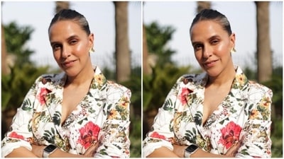Neha looked super stylish in the white blazer printed in multicoloured floral patterns, featuring lapel collars and rolled up sleeves. She teamed it with a matching pair of formal trousers. (Instagram/@nehadhupia) Neha looked super stylish in the white blazer printed in multicoloured floral patterns, featuring lapel collars and rolled up sleeves. She teamed it with a matching pair of formal trousers. (Instagram/@nehadhupia)