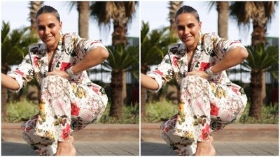 Neha slicked her tresses into a clean bun with a middle part as she posed for the outdoor photoshoot. High heels + deep squat … aaj ke liye itna hi (that's all for today),” read her caption. (Instagram/@nehadhupia) Neha slicked her tresses into a clean bun with a middle part as she posed for the outdoor photoshoot. High heels + deep squat … aaj ke liye itna hi (that's all for today),” read her caption. (Instagram/@nehadhupia)