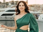 Sunny Leone shares first pictures from Cannes looking like a summer dream in green cut-out gown. Sunny Leone shares first pictures from Cannes looking like a summer dream in green cut-out gown.