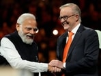 Prime Minister Narendra Modi, left, shakes hands with Australian Prime Minister Anthony Albanese during an Indian community event at Qudos Bank Arena in Sydney, Australia, Tuesday.